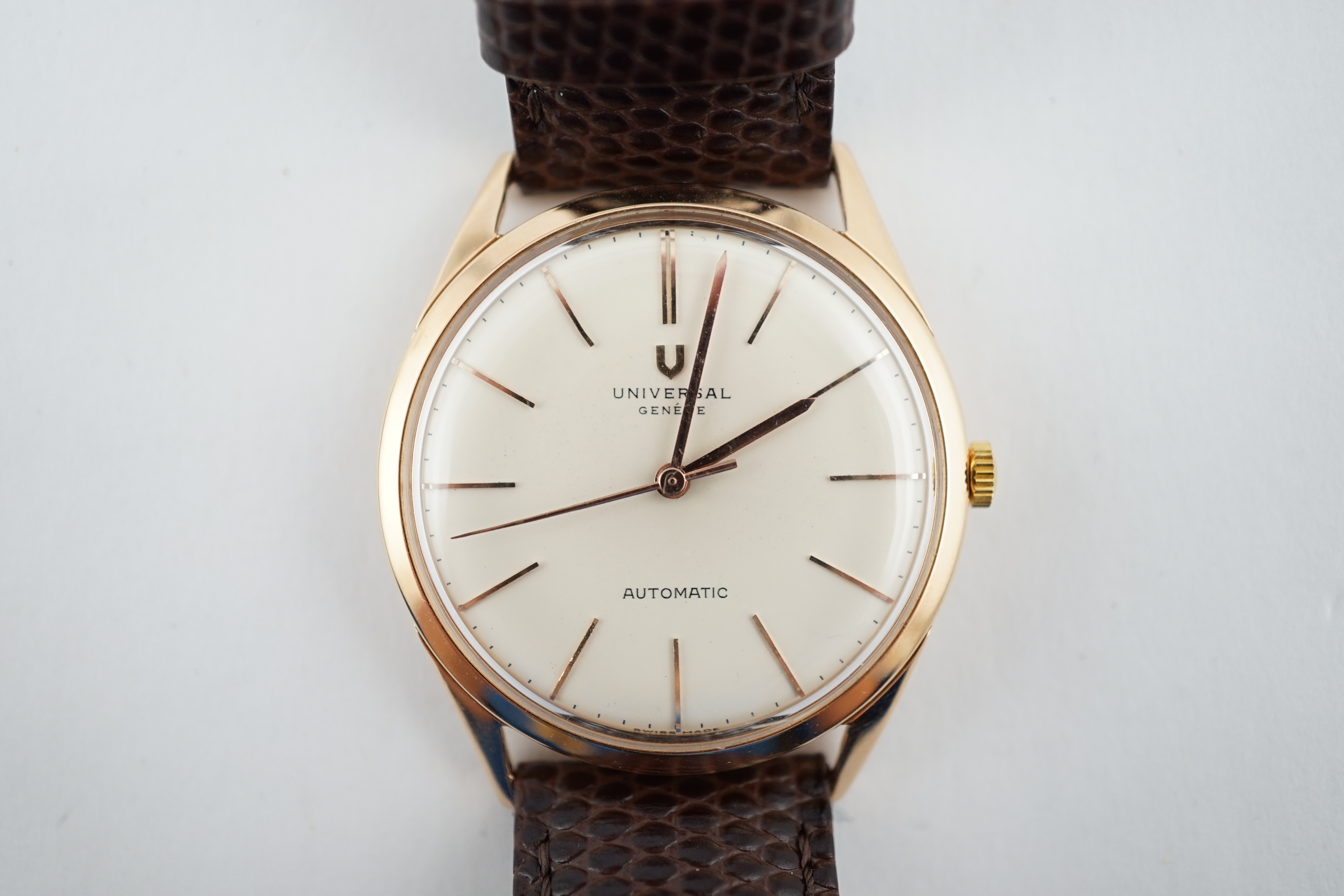 A gentleman's 1950's 18k pink gold Universal automatic wrist watch